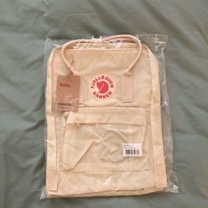 Fjallraven Kanken Backpack (Light Oak). It’s in brand new condition.